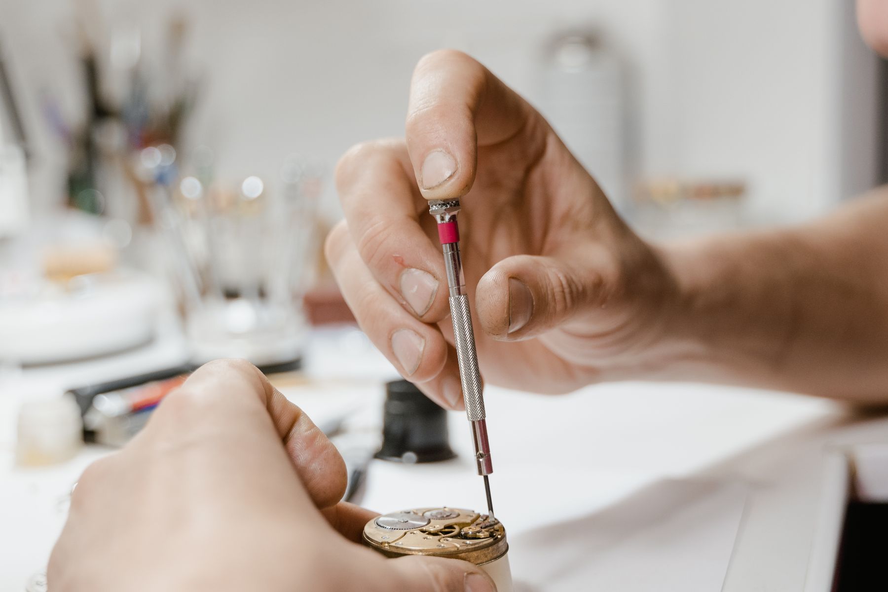 Precision screwdriver work on a clock movement